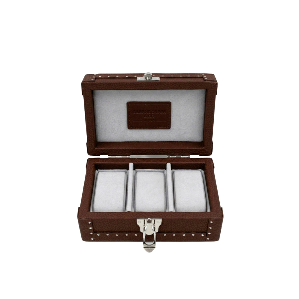 Open cognac leather watch box showing Alcantara lining and individual watch cushions