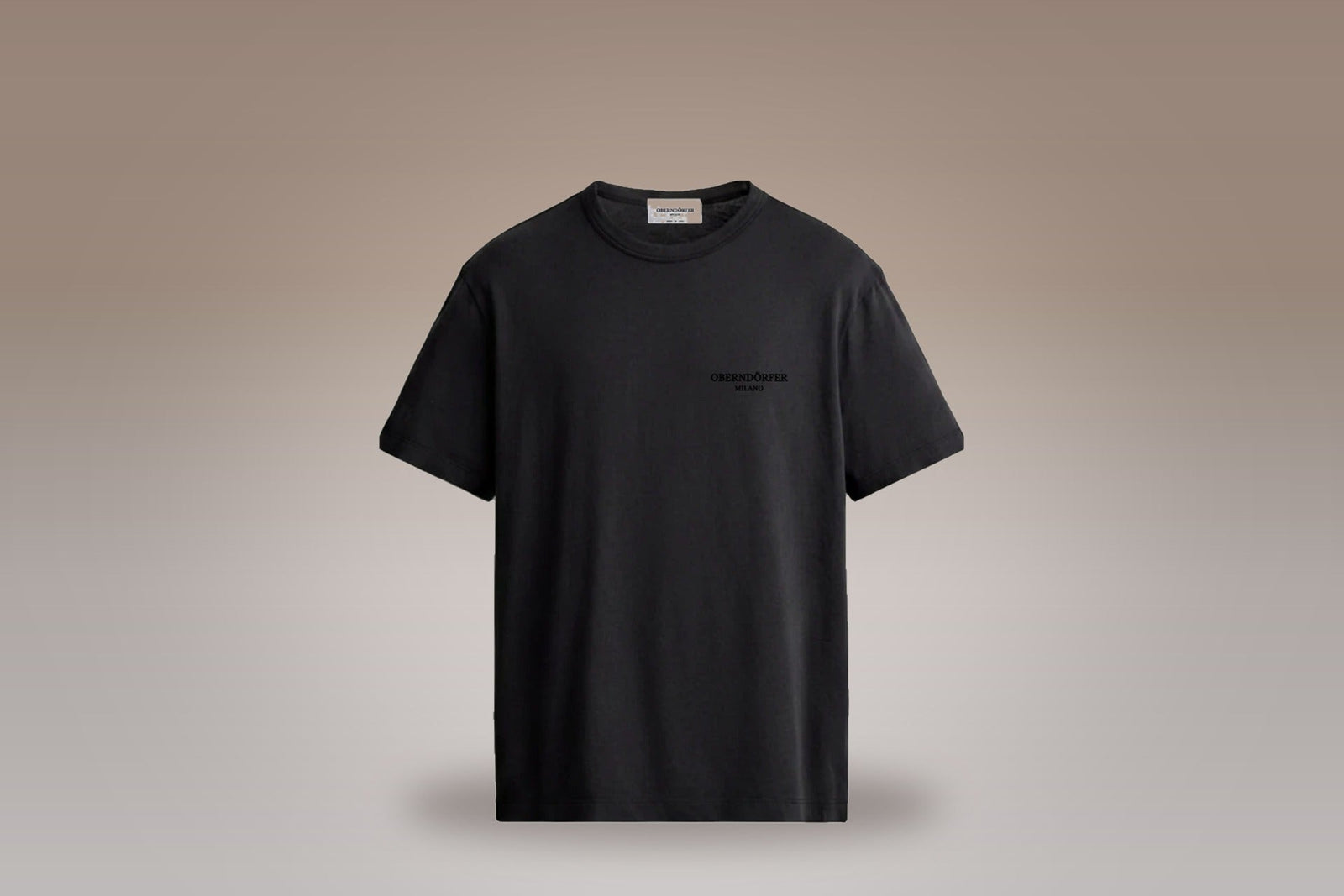 Embroidered T-Shirt in black on a taupe studio ground - Oberndörfer Milano Ready to Wear