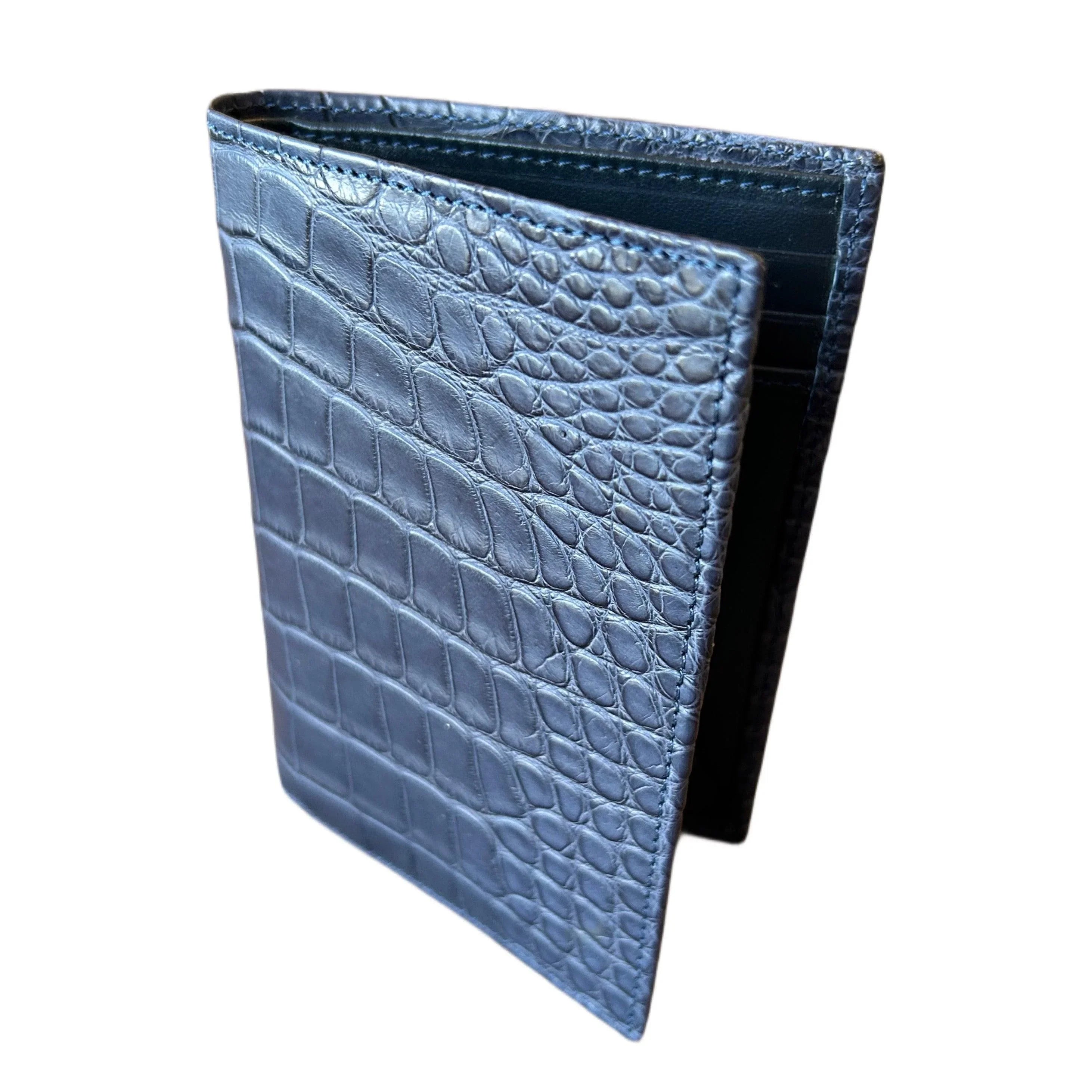 Blue crocodile-embossed leather wallet standing upright on white background