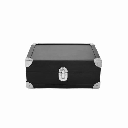 Black leather storage box with silver metal corners and latch on white background