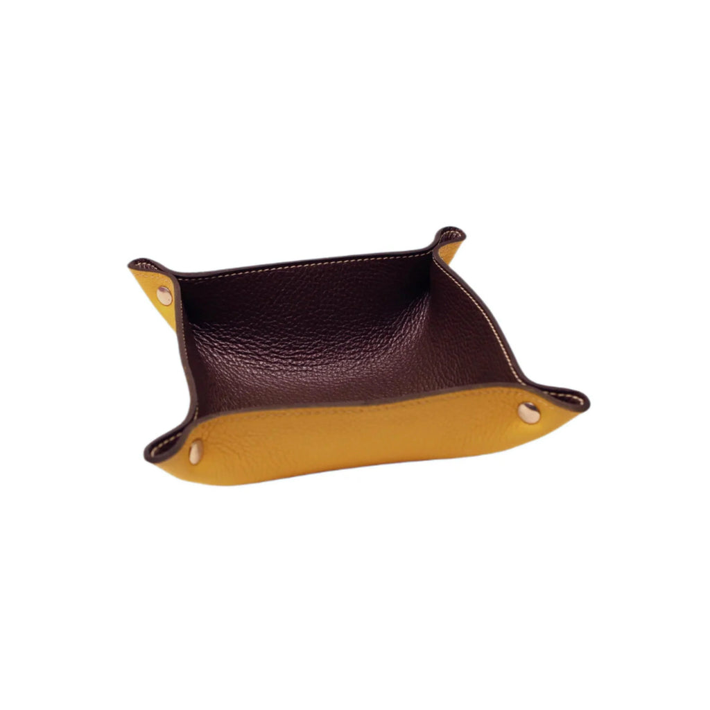 Handcrafted Italian leather valet tray in brown and yellow with gold snaps, on white background