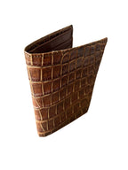 Chocolate brown crocodile leather wallet, standing upright on white background