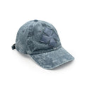 Front view of a faded stone-blue washed cotton six-panel baseball cap with the Oberndörfer Milano logo cut from calf leather