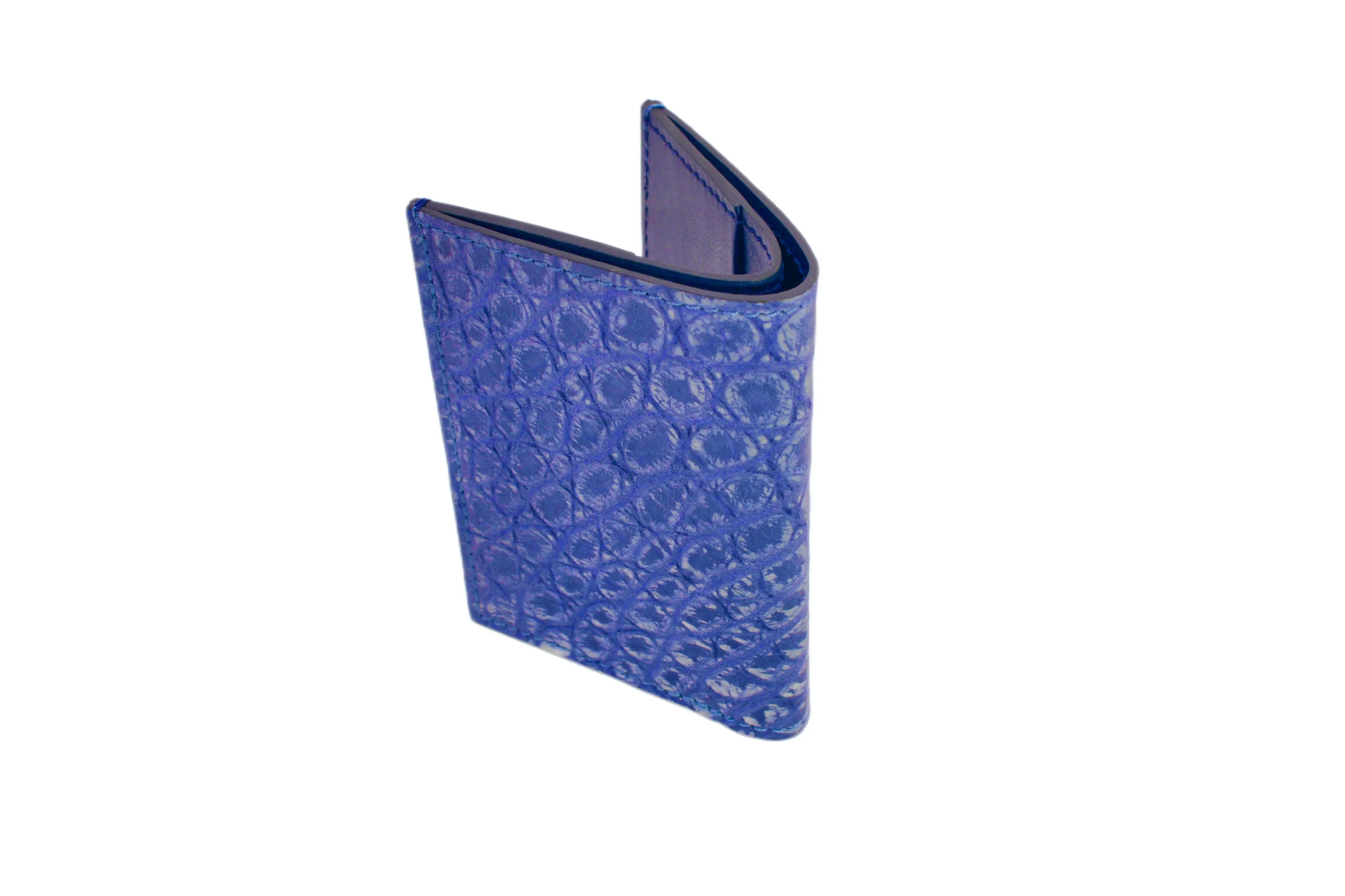 Blue textured leather wallet with embossed pattern, standing upright on white background