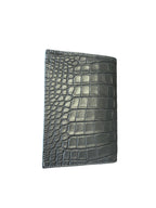 Grey crocodile leather wallet close-up of exotic leather texture