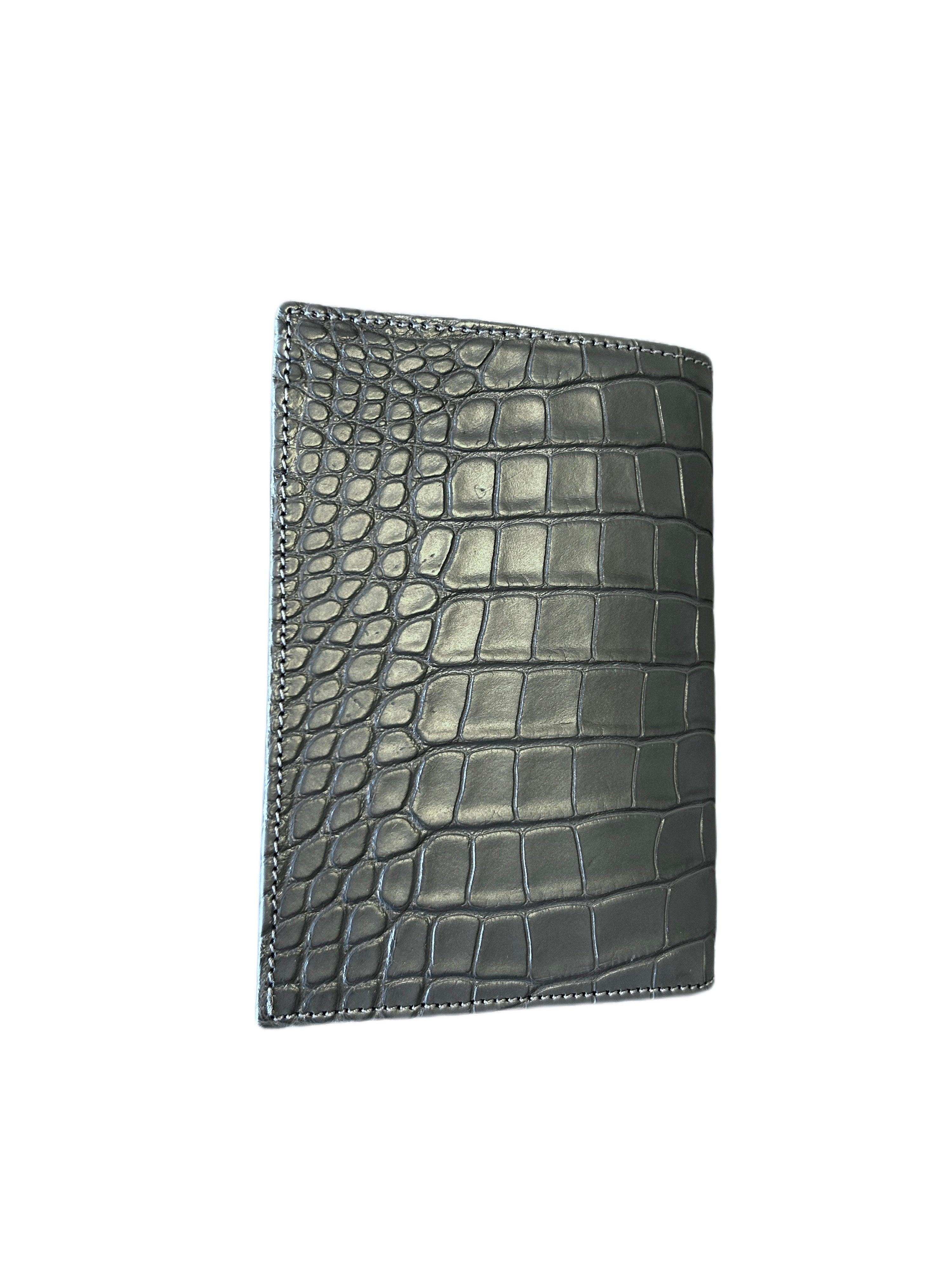 Handcrafted black Italian leather wallet with crocodile pattern on white background