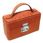 Ostrich Mirror Handbag side view showing quill pattern texture