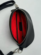 Leather belt bag worn around waist, side view