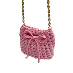 Pink mini crochet handbag close-up showing woven texture