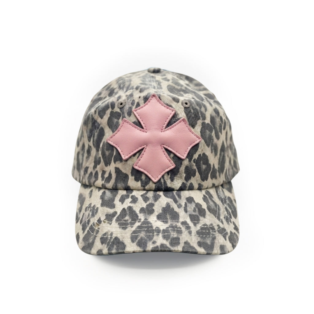 Front view of a stone and charcoal leopard print washed cotton baseball cap with a pink calf leather logo patch