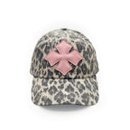 Front view of a stone and charcoal leopard print washed cotton baseball cap with a pink calf leather logo patch