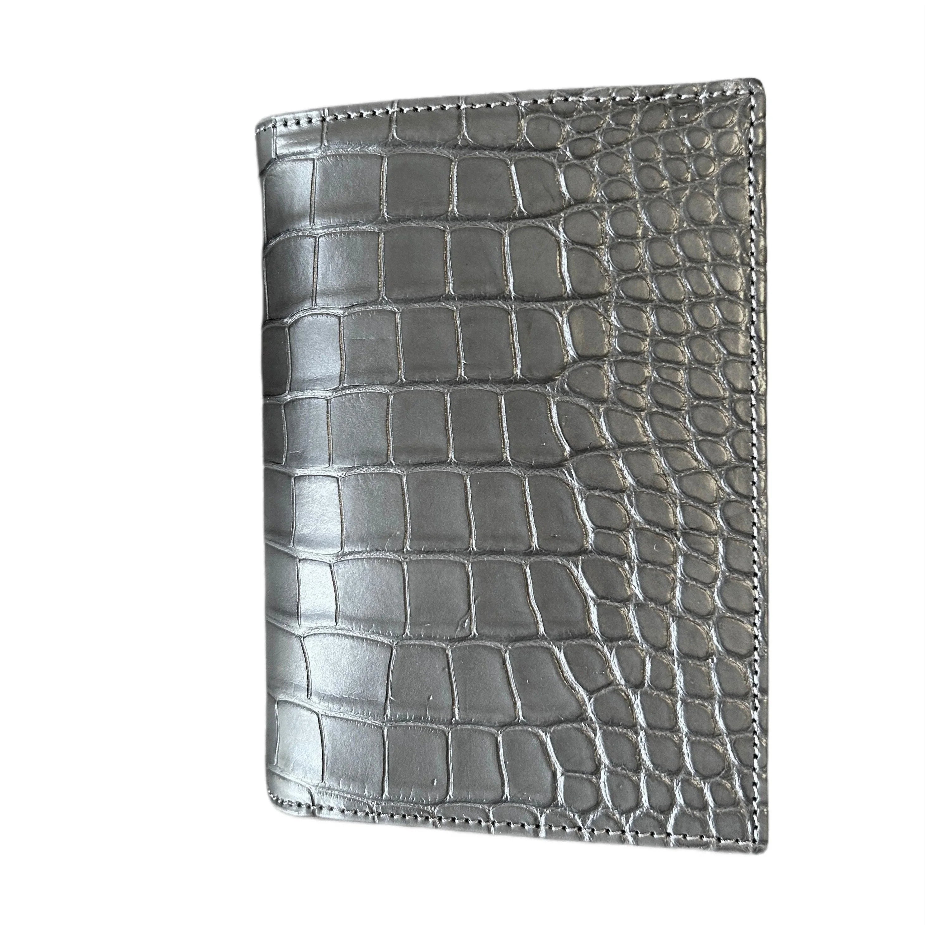 Gray crocodile-embossed leather wallet with detailed stitching on white background
