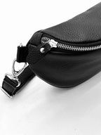 Leather belt bag back view showing strap attachment