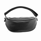 Leather belt bag worn as crossbody bag