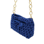 Blue crochet handbag interior view showing lining and closure
