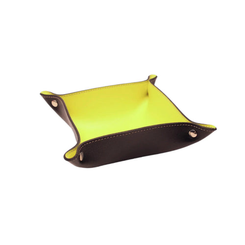 Brown and yellow leather valet tray with gold snaps on white background