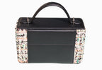 Black Mirror Handbag carried by hand, front view