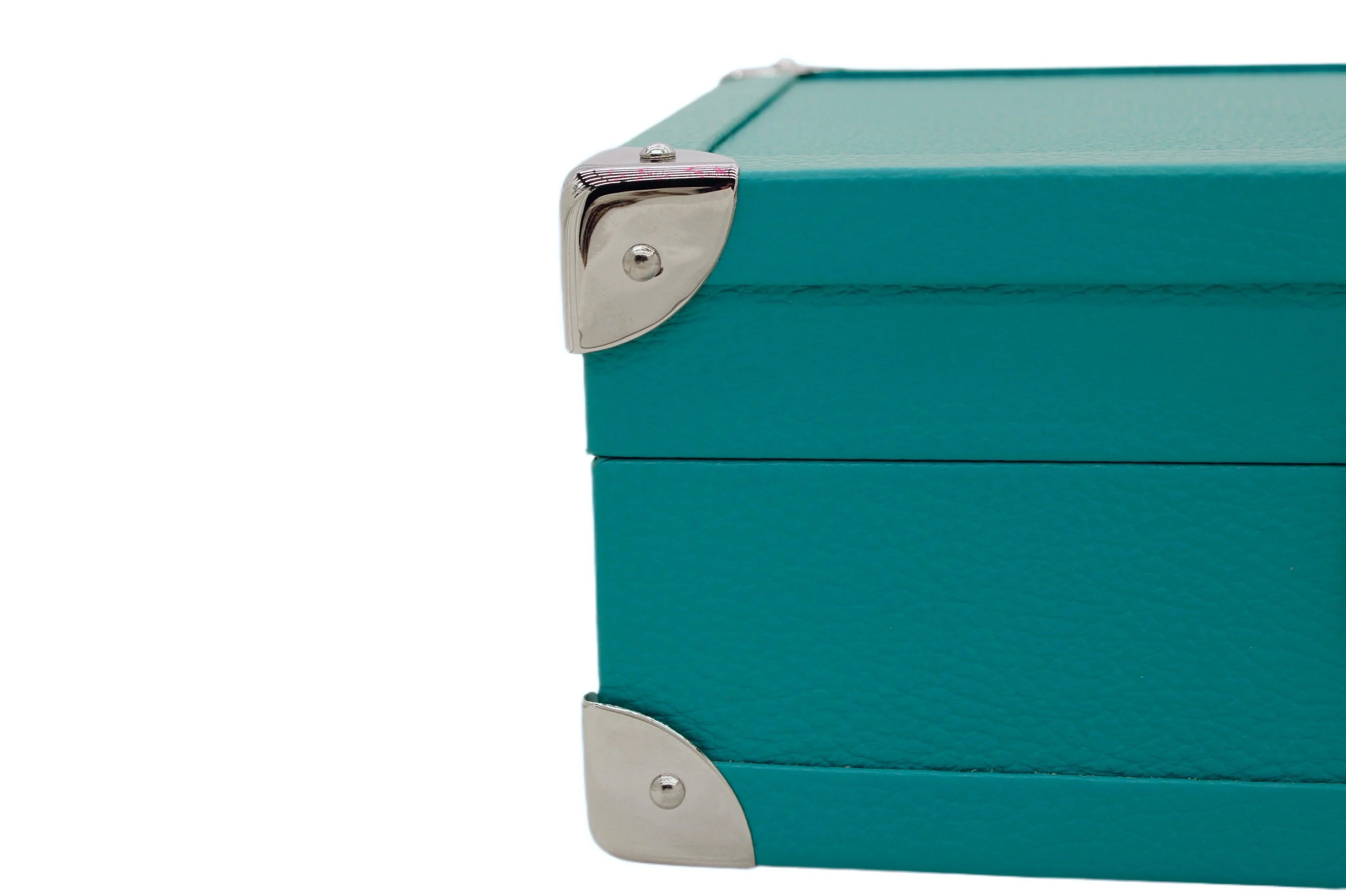 Turquoise leather box corner with silver metal accents, handcrafted luxury accessory