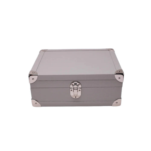 Taupe leather jewelry box with metal corners and silver clasp, luxury storage case
