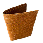 Light brown crocodile leather wallet with visible card slots, luxury handcrafted design