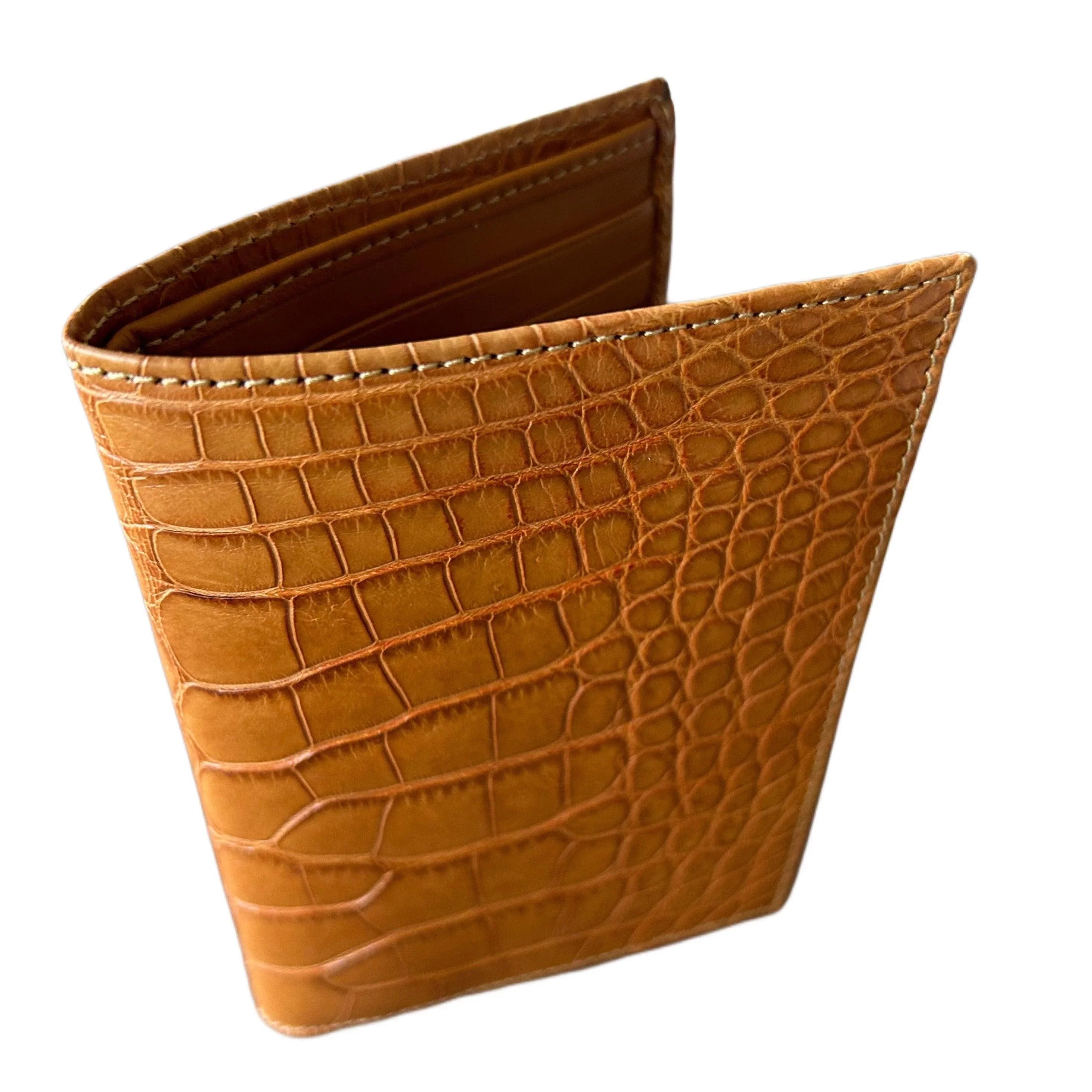 Brown crocodile-embossed leather wallet with visible card slots, luxury handcrafted design