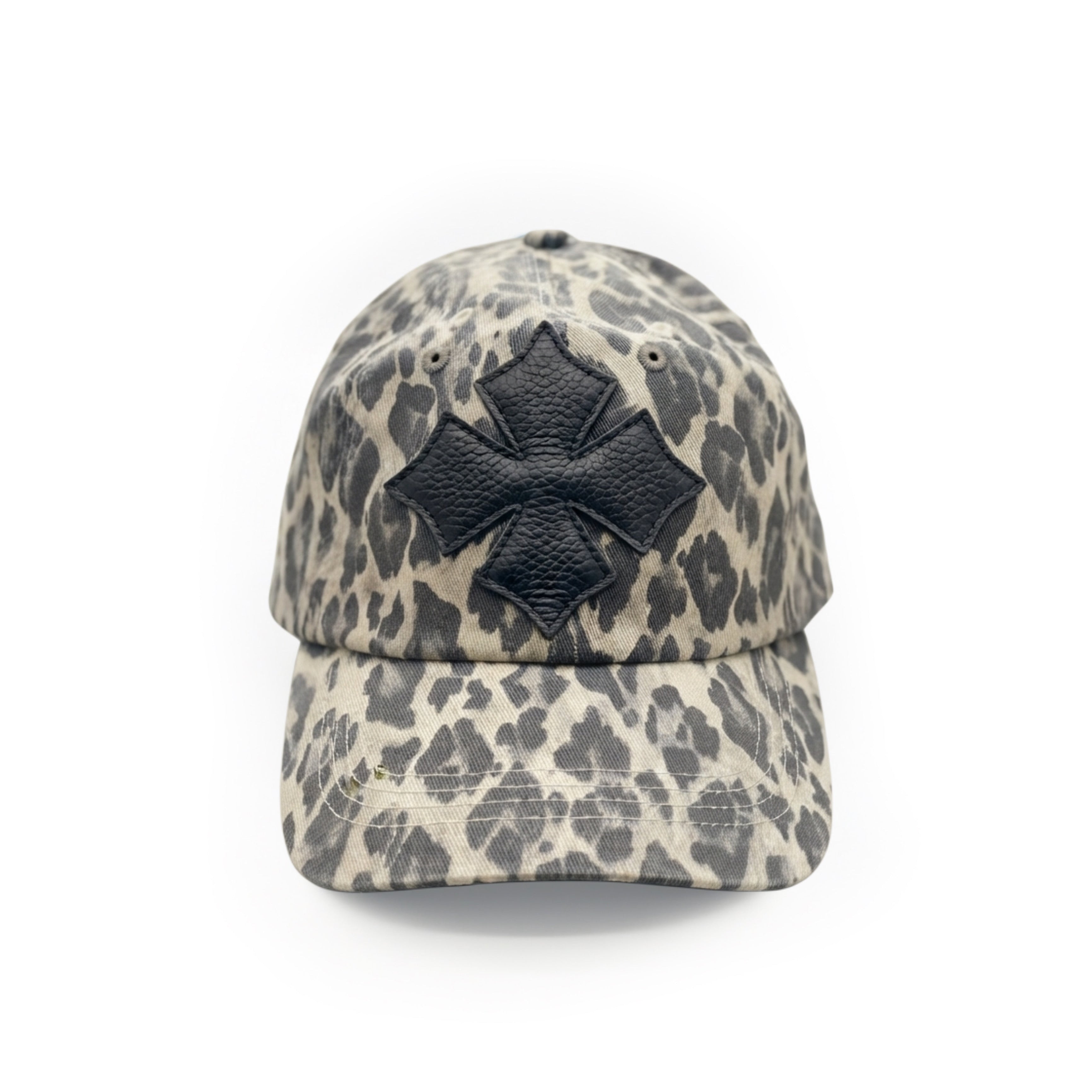 Front view of a stone and charcoal leopard print washed cotton baseball cap with a black calf leather logo patch