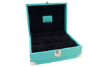 Turquoise leather watch box with black velvet interior and silver hardware, open lid