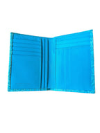 Turquoise crocodile leather wallet close-up of exotic leather texture