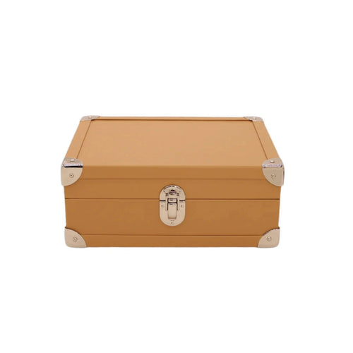 Tan leather storage box with silver metal corners and latch, luxury handcrafted design