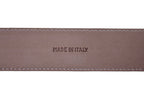 Black leather belt close-up of round buckle hardware