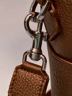 Brown leather briefcase close-up of Togo leather texture
