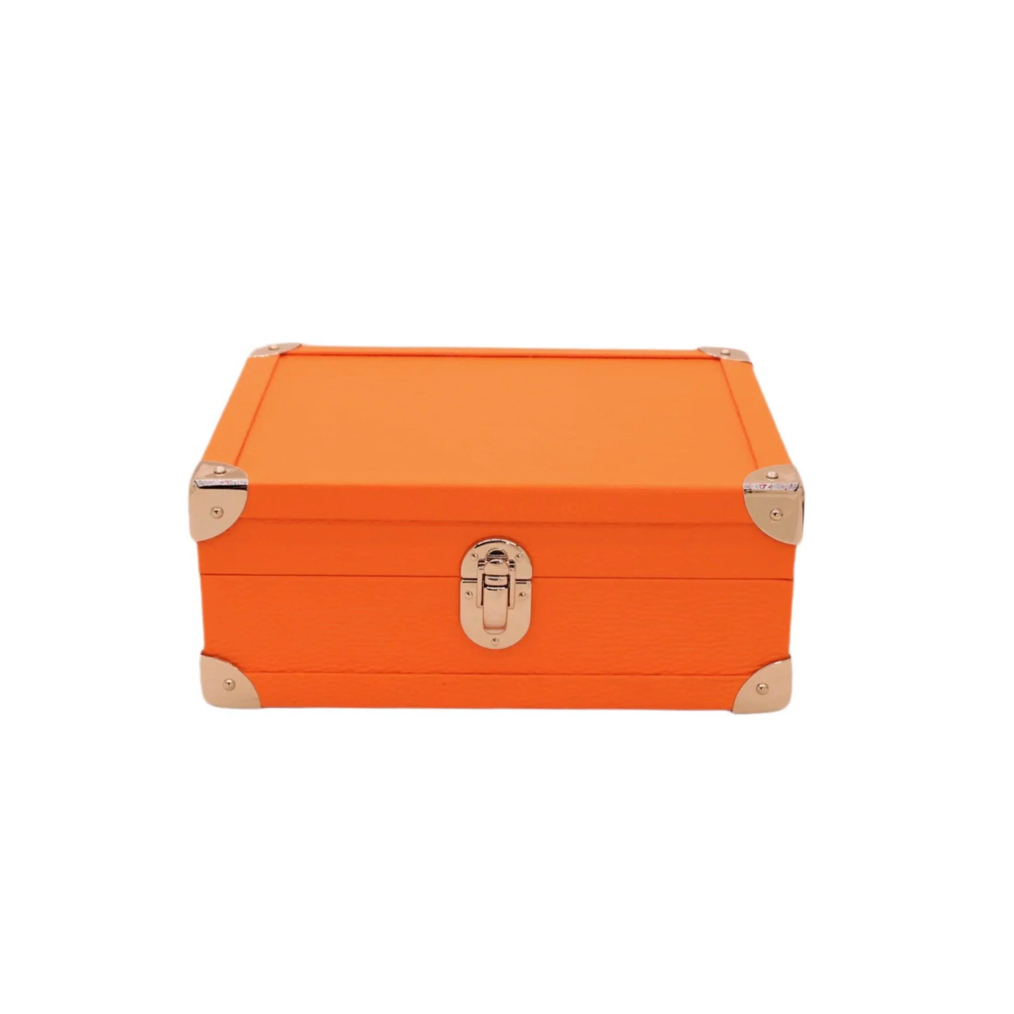 Orange handcrafted leather box with metal corners and latch on white background