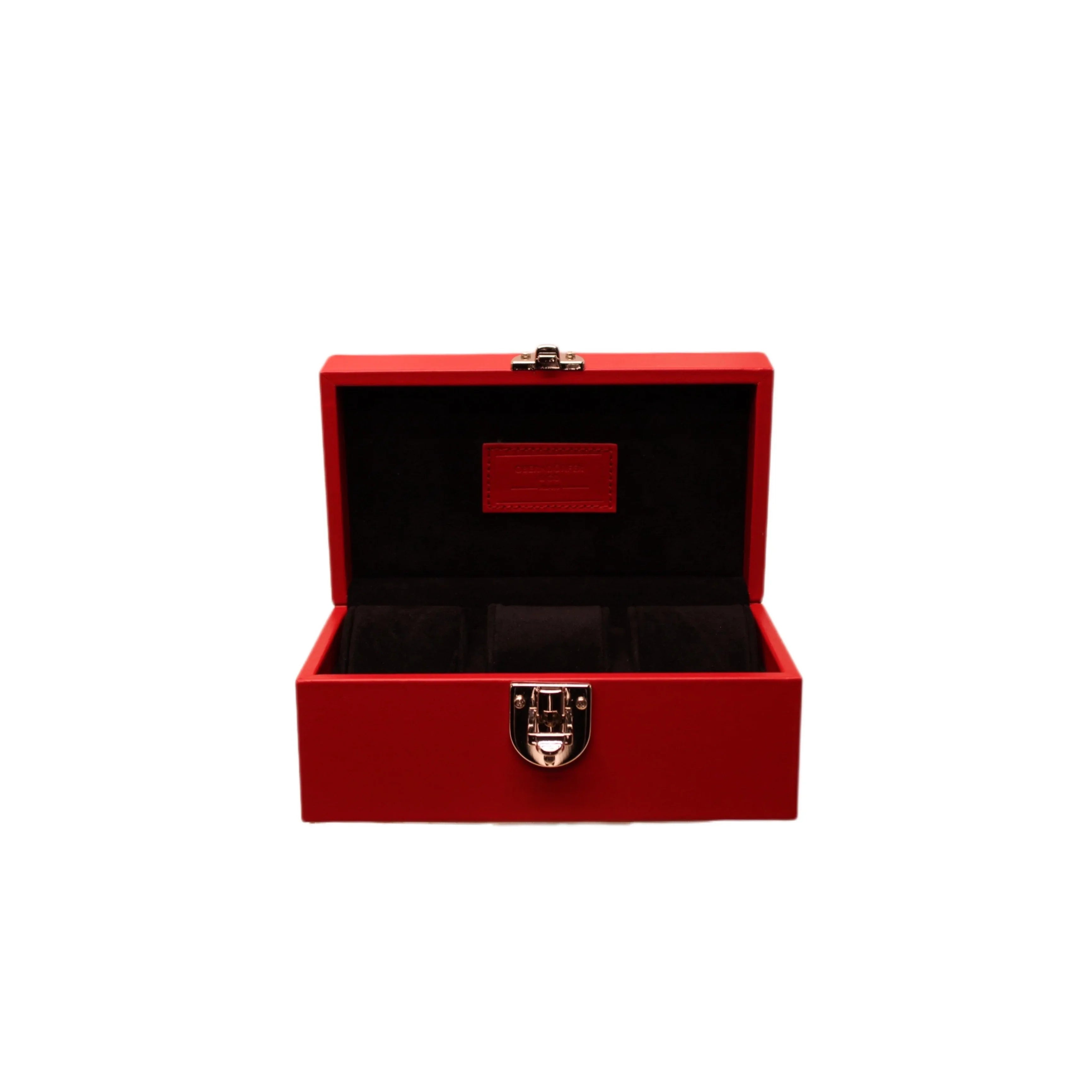 Red Italian leather watch box with black velvet interior and silver clasp, open lid