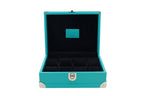 Open turquoise leather watch box with black velvet interior and compartments