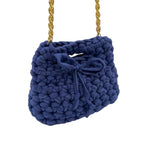 Blue mini crochet handbag close-up showing woven texture