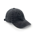 Three-quarter view of the black washed cotton cap showing the tonal black calf leather logo patch