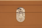 Tan leather box with polished silver latch clasp, luxury handcrafted detail