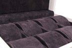 Close-up of a luxury suede-lined watch storage case with multiple compartments