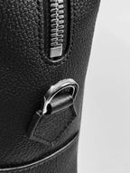 Black leather briefcase flat lay showing full silhouette