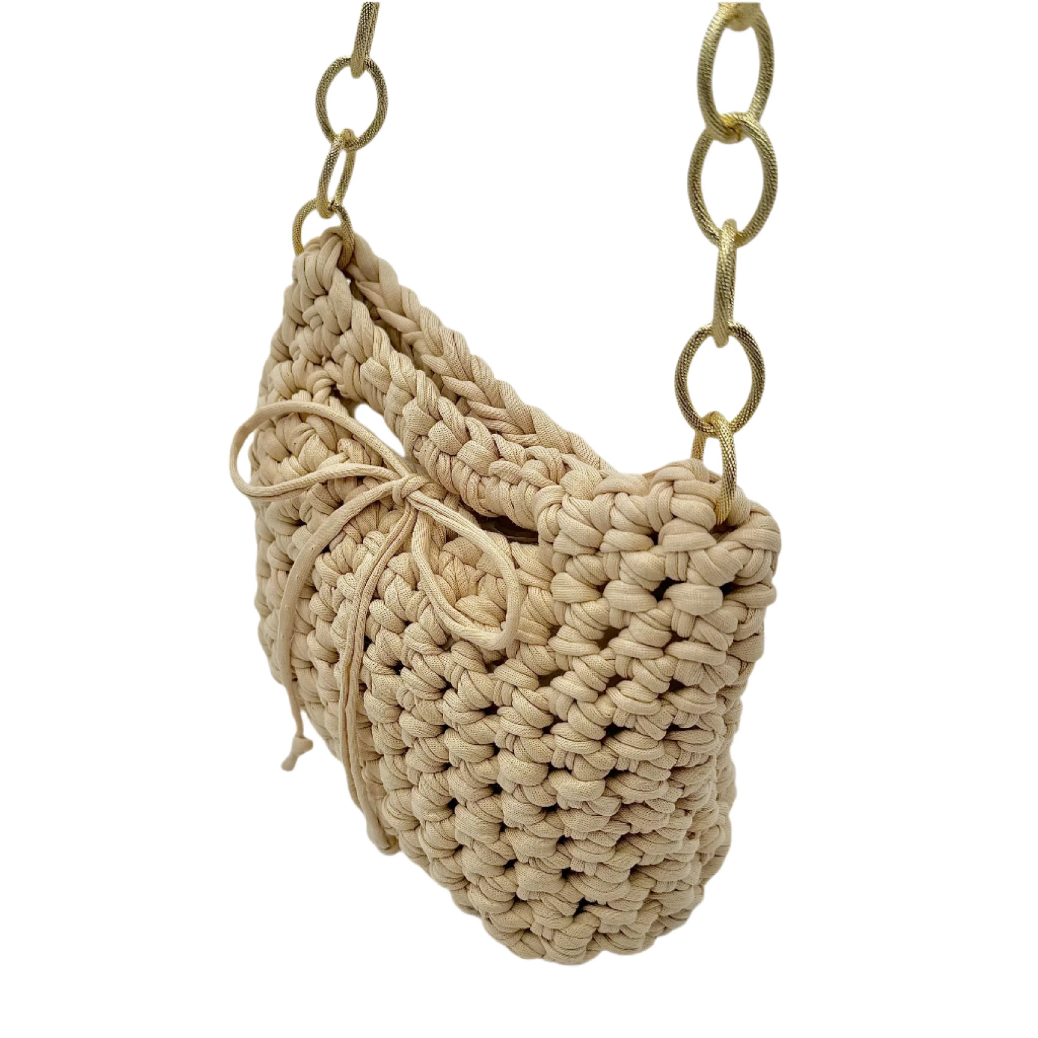 Beige crochet handbag close-up showing woven texture and hardware
