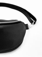Leather belt bag worn crossbody, front view