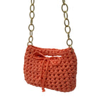 Peach crochet handbag interior view showing lining and closure