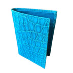 Turquoise crocodile leather wallet, angled view showing card slots