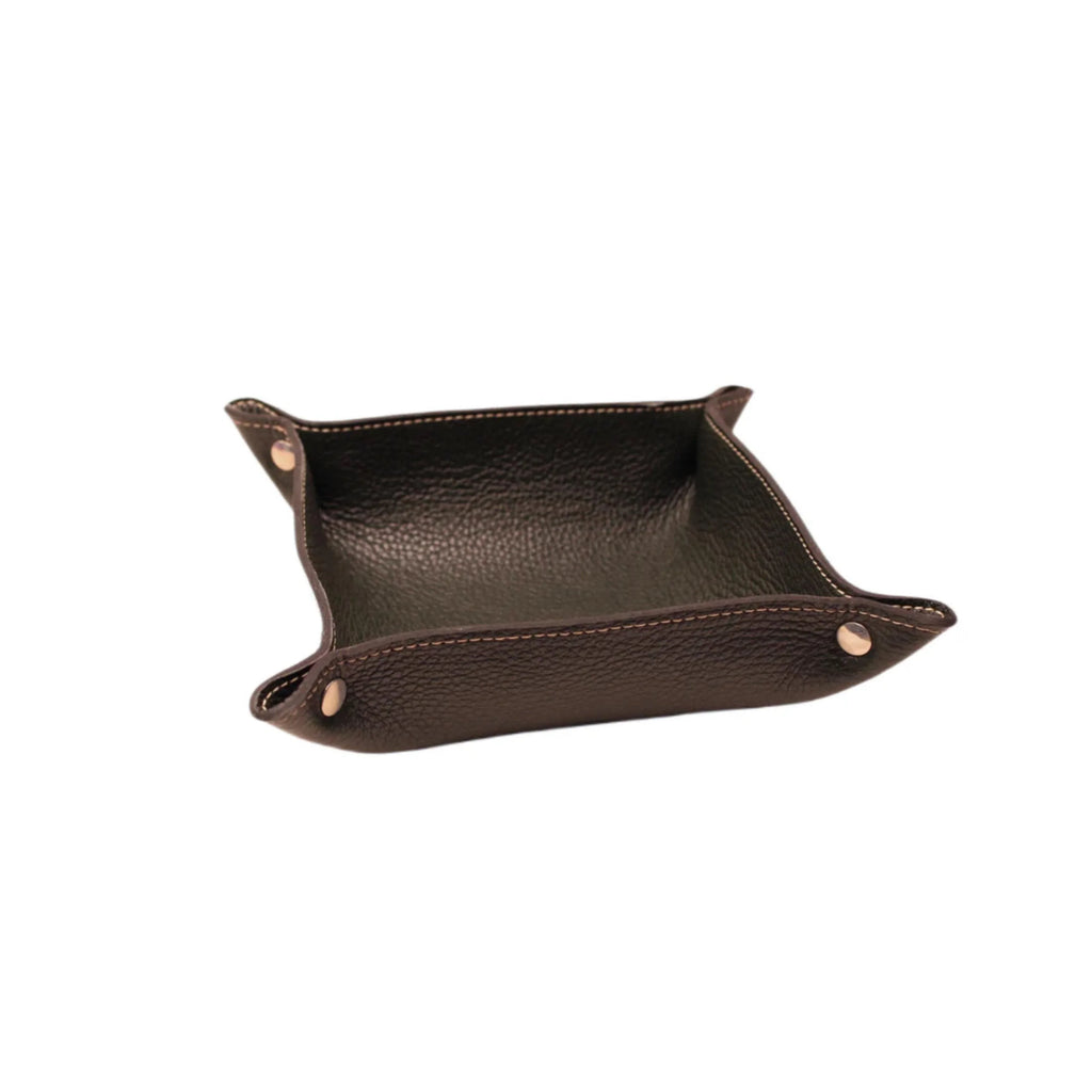 Handcrafted Italian leather valet tray with snap buttons and visible stitching on white background