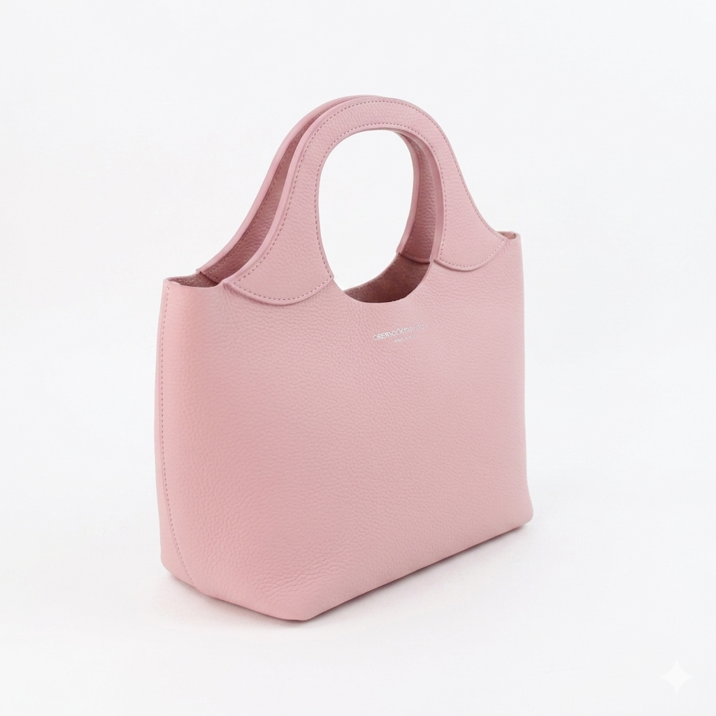 Pink Togo calf leather tote bag close-up showing structured top handle