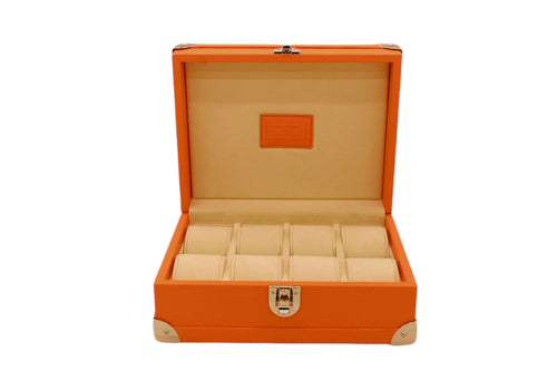 Luxury orange leather watch box with beige interior and multiple compartments, open lid