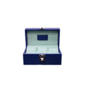 Open blue leather jewelry box with soft light interior and silver clasp