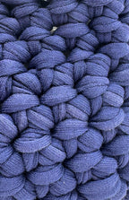Blue mini crochet handbag interior view showing lining and closure