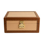 Beige and brown leather box with gold lock on a white background