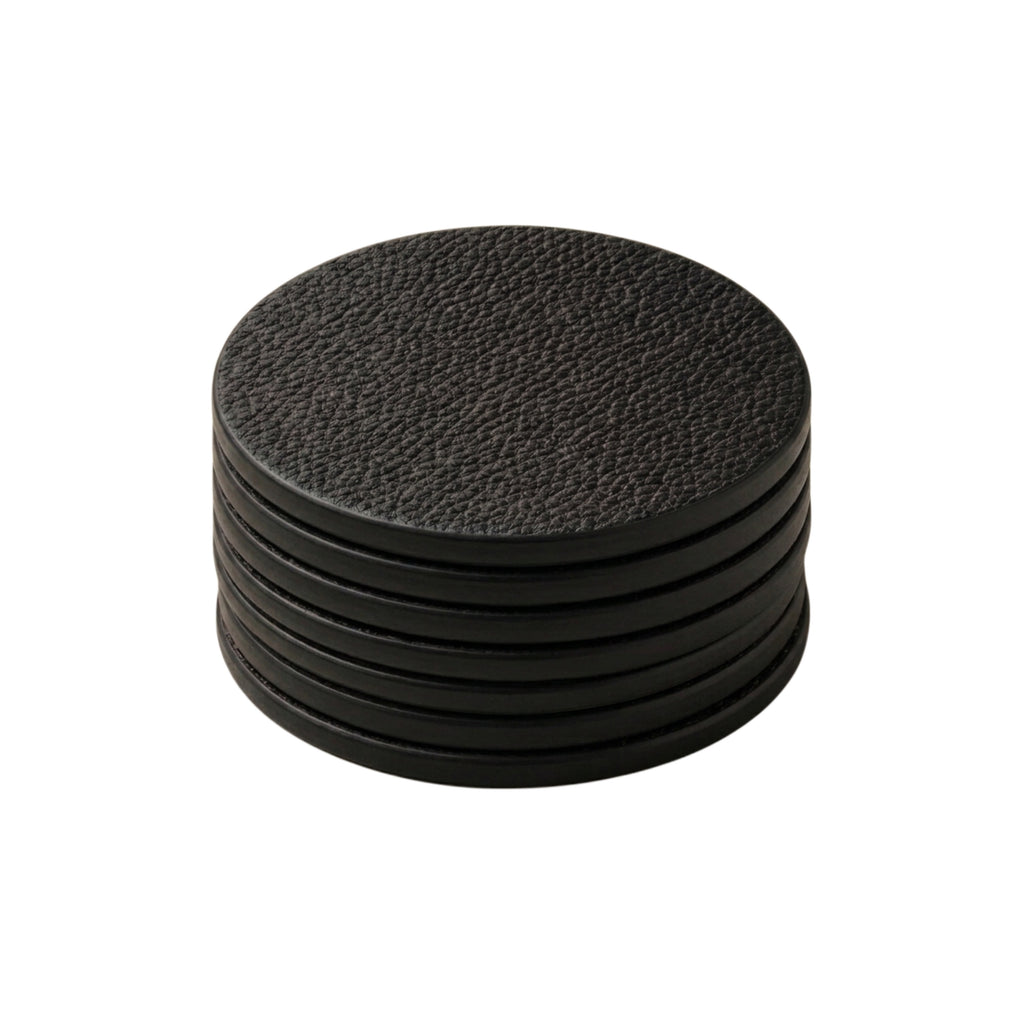 Set of 7 black full-grain calf leather coasters stacked - Italian leather coaster set handmade in Italy by Oberndörfer Milano